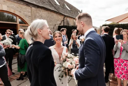 Couple chatting with Lynn after the ceremony