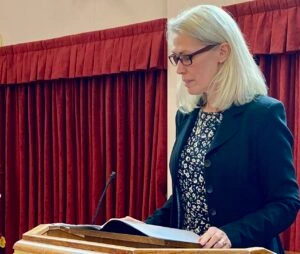 Lynn reading at a ceremony