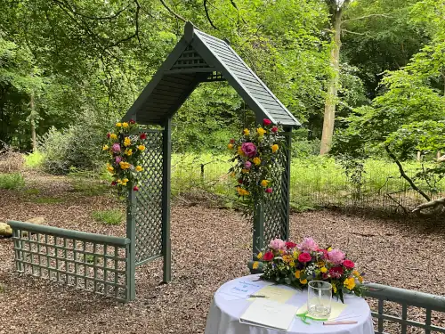 Wedding book on table in front of archway